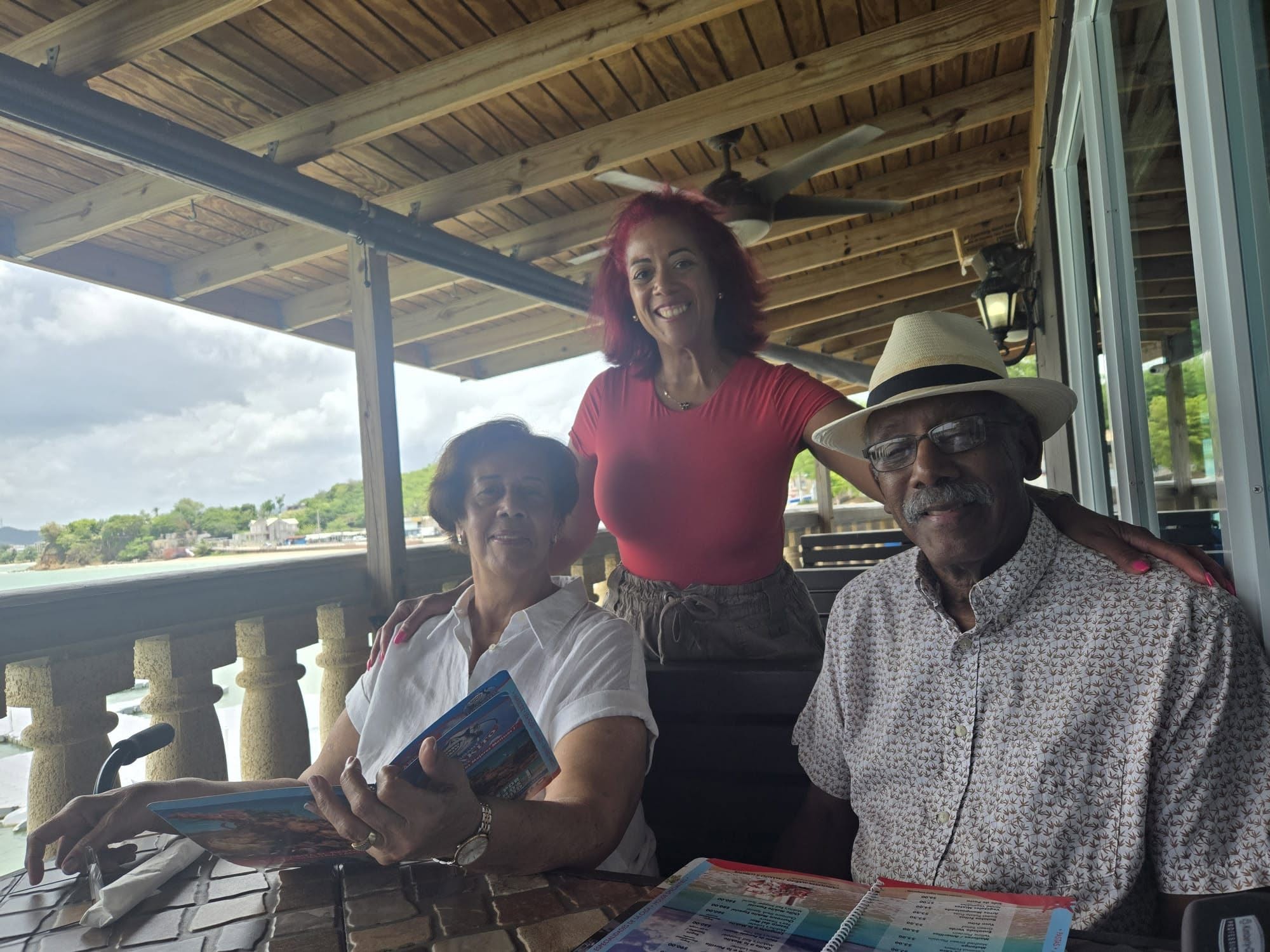Minerva with her family at a seaside café in Puerto Rico